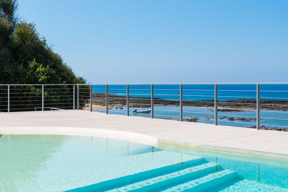 the outdoor pool, by the sea