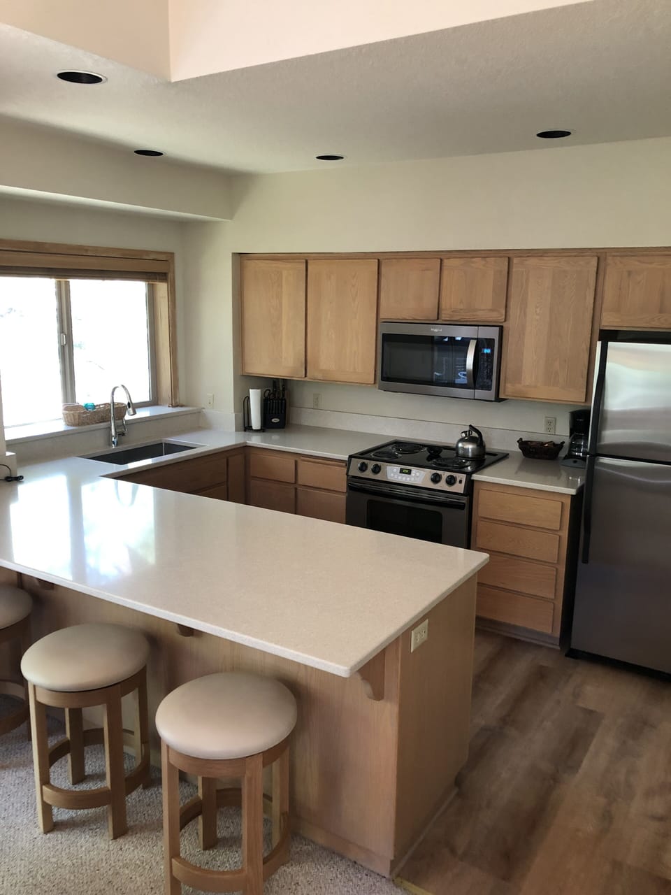 Newly remodeled kitchen with new appliances, sink, and granite counter tops. 