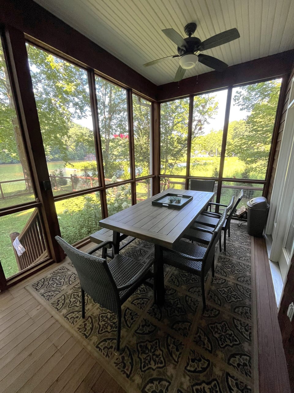 Enjoy meals, games or puzzles on the back porch facing the lake.