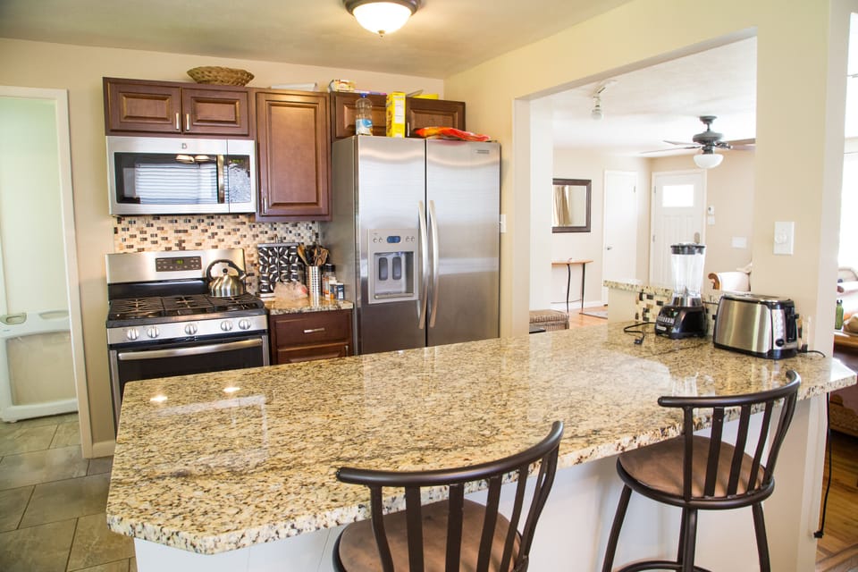 Kitchen with brand new appliances and cabinets,  Granite counter tops, Island

