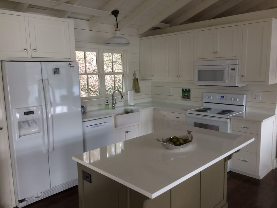 Our fully stocked kitchen showing the refrigerator, washer, stove and microwave.