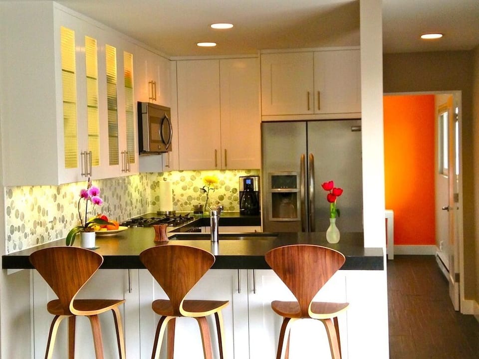 all stainless custom appliances, dishwasher and industrial-grade range