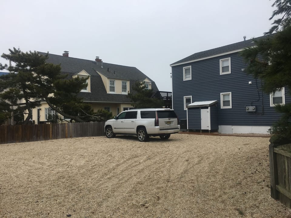 Large parking lot fits four cars easily!