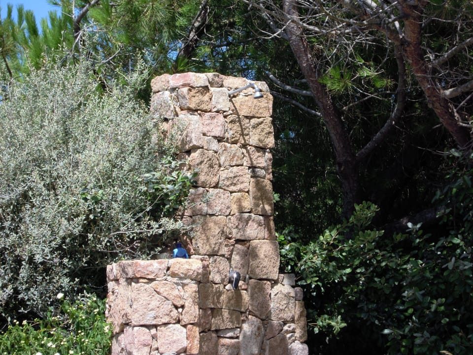 Granite shower in the garden equipped with hot water
