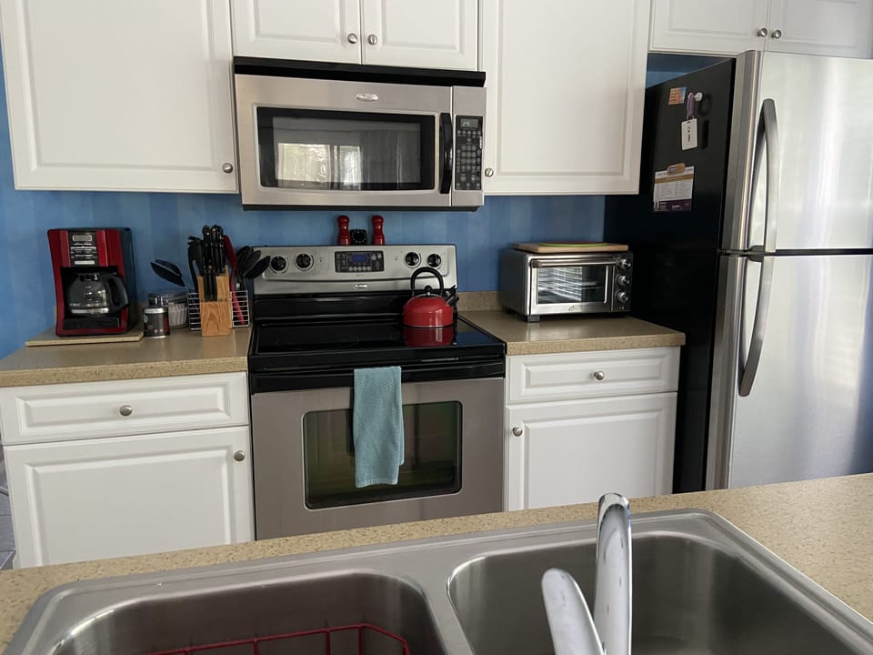 Complete Stainless steel kitchen (dishwasher, range, microwave and refrigerator)