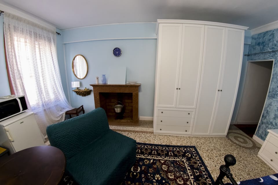 Fireplace area and 4 door wardrobe