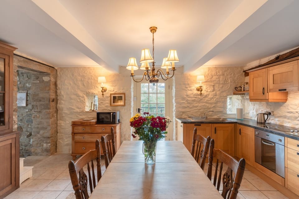 Our eat in kitchen.  Dishwasher, fridge , washer behind cabinetry; stove/oven