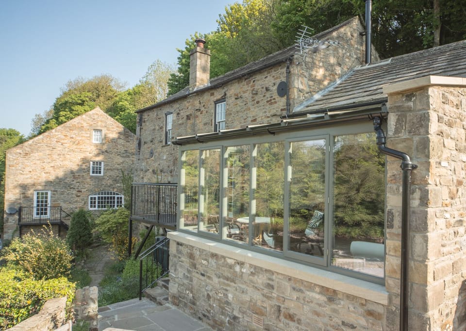 River Run Cottage in the foreground with the neighbouring Mill House