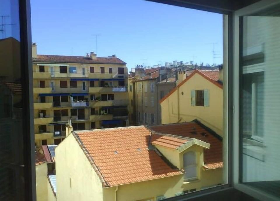 View of the roof tops from living room & bedroom