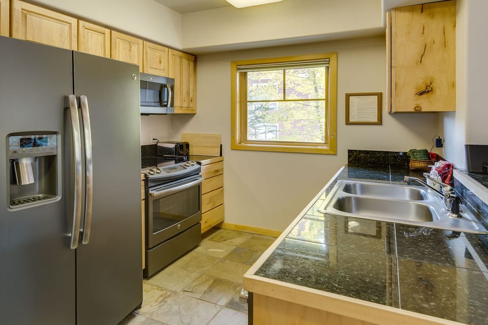 Well-equipped kitchen with new slate appliances
