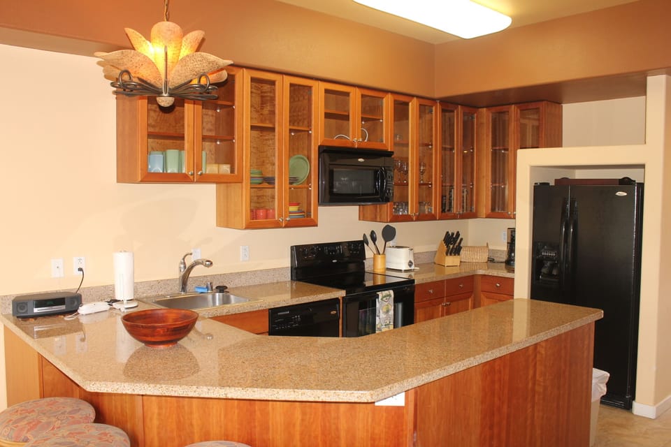 Full Gourmet Kitchen with Fridge, Dishwasher, Cookware, Utensils, and More.