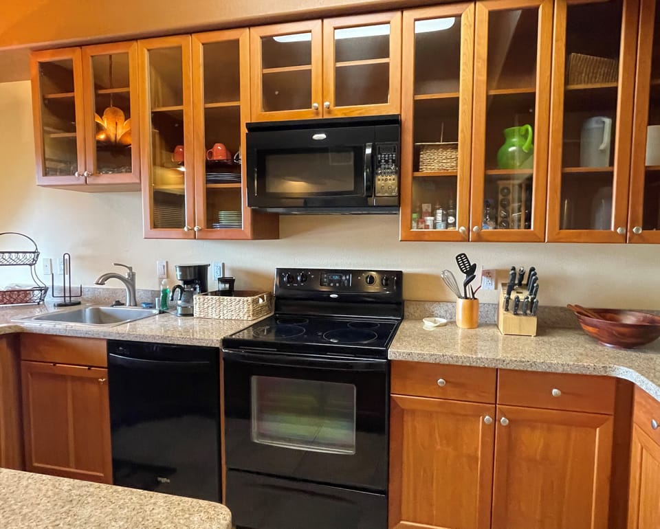 Gourmet Kitchen with Stove, Microwave Oven & Dishwasher.