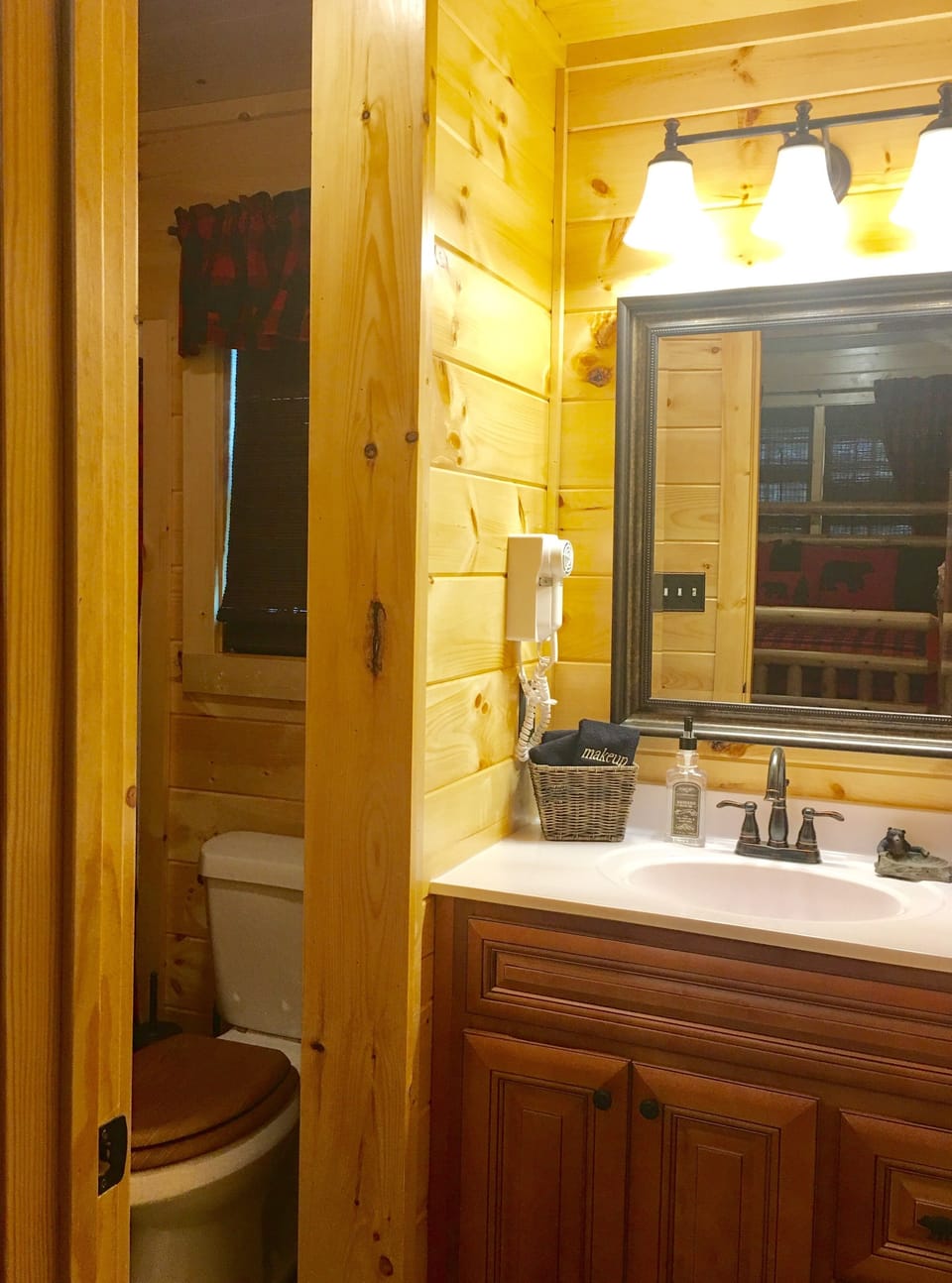 Bathroom Vanity has space for your things and a blow dryer for your convenience