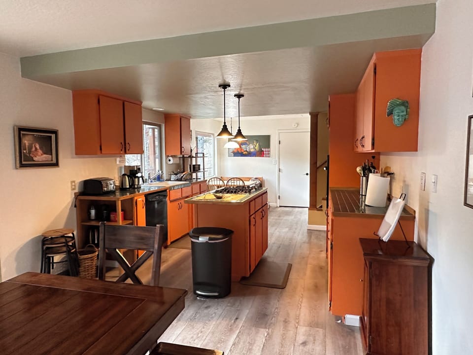 kitchen with a breakfast nook on its other end