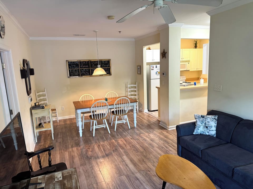 Open layout between living + dining room, partially open to kitchen