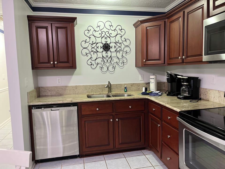 Kitchen showing dishwasher, microwave and stove.