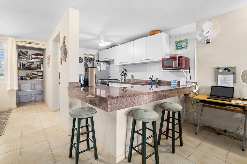 Granite kitchen area with computer desk.  Private wi-fi and wired VPN internet