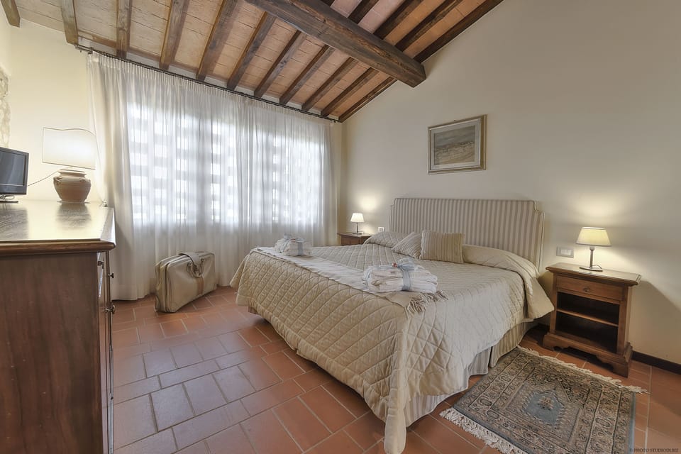 One of the 2 bedrooms (double-, or with 2 single-beds, or with 3 single-beds)