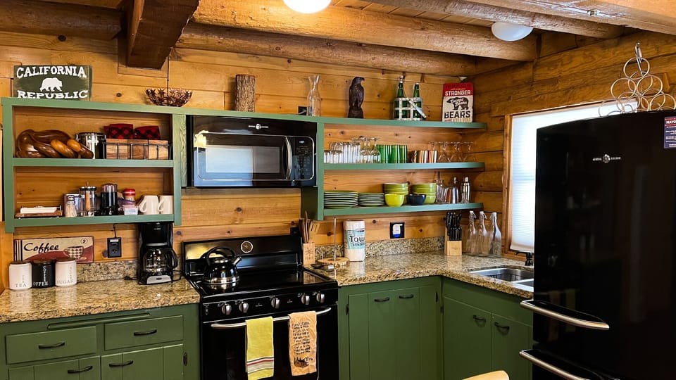 Renovated kitchen with newer appliances and granite countertops