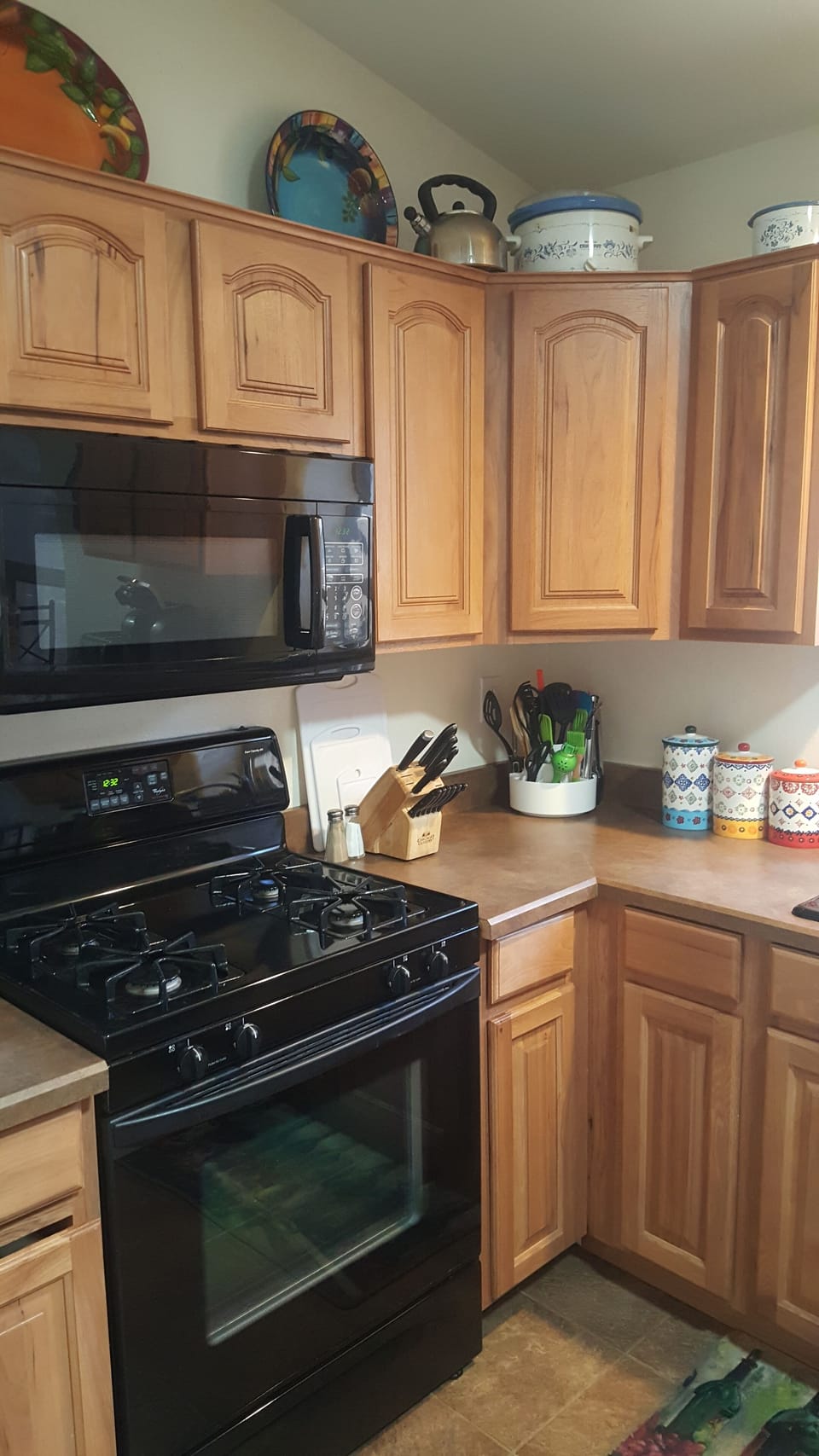 gas range/oven and microwave; crock pots; griddle  and blender in cupboard