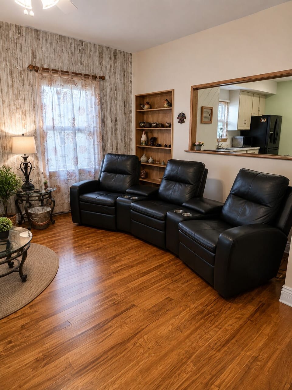 Comfortable living room with reclining theater-style seating.