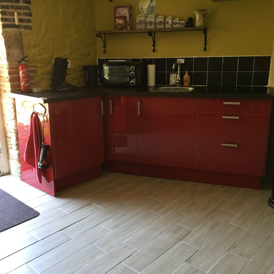 Kitchen with built in fridge, coffee machine, oven and hob