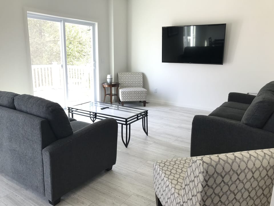 1st Living Room - with pullout couch and 65" large screen TV