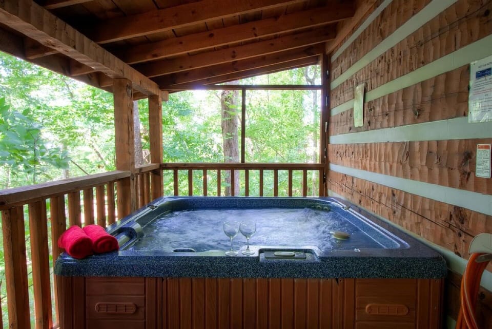Relax in the hot tub after a great day in the Smokies on the large covered deck.