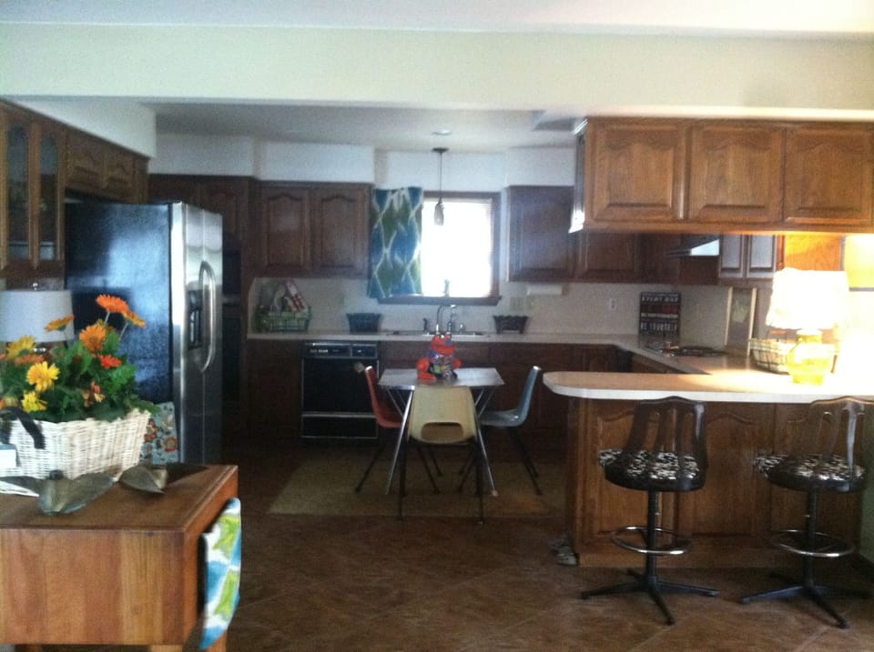 Kitchen has seating for 6.  Stocked with cooking and serving essentials.
