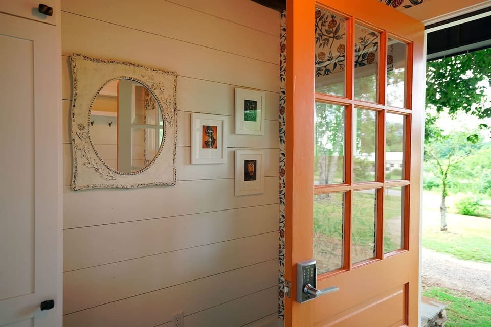 Mudroom--elegant equine photographs adorn the space