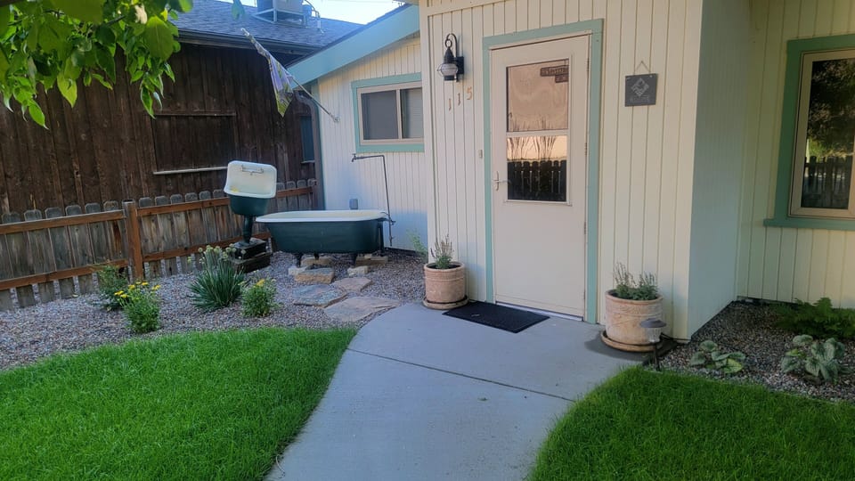 Newly landscaped front yard complete with fun yard art and water features!