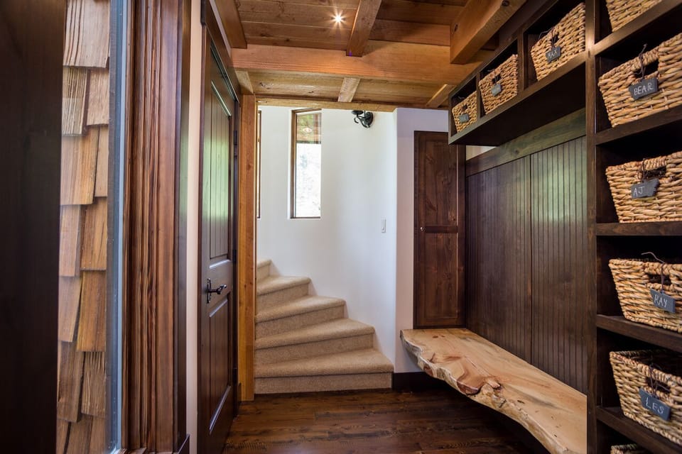 The entryway with cubbies and the spiral staircase to the second floor loft.