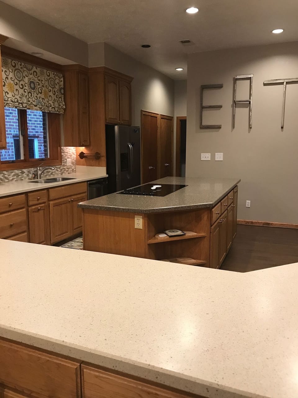 large kitchen, cooktop, fridge and pantry