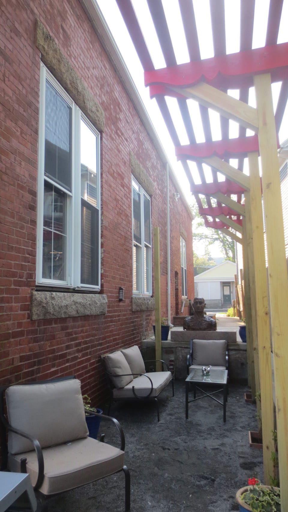 Water view patio with seating and barbecue for guests