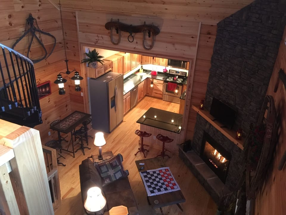 loft view of  living room, breakfast area, and kitchen