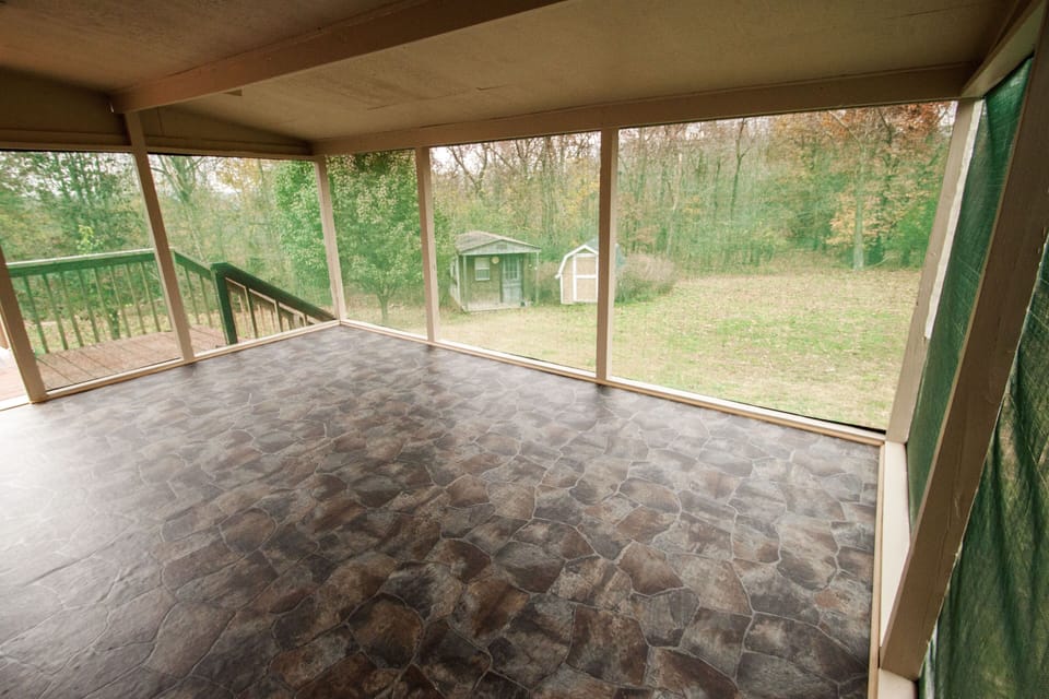 Screened in porch on back of house