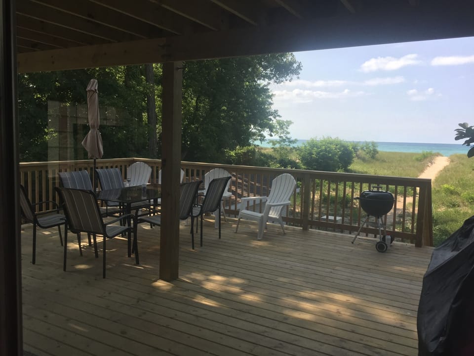 First floor porch with plenty of seating 