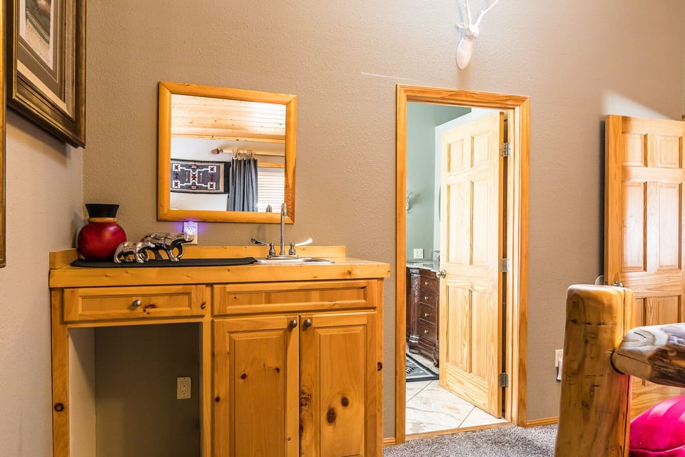 Master bedroom with bar area and entrance to Master bathroom