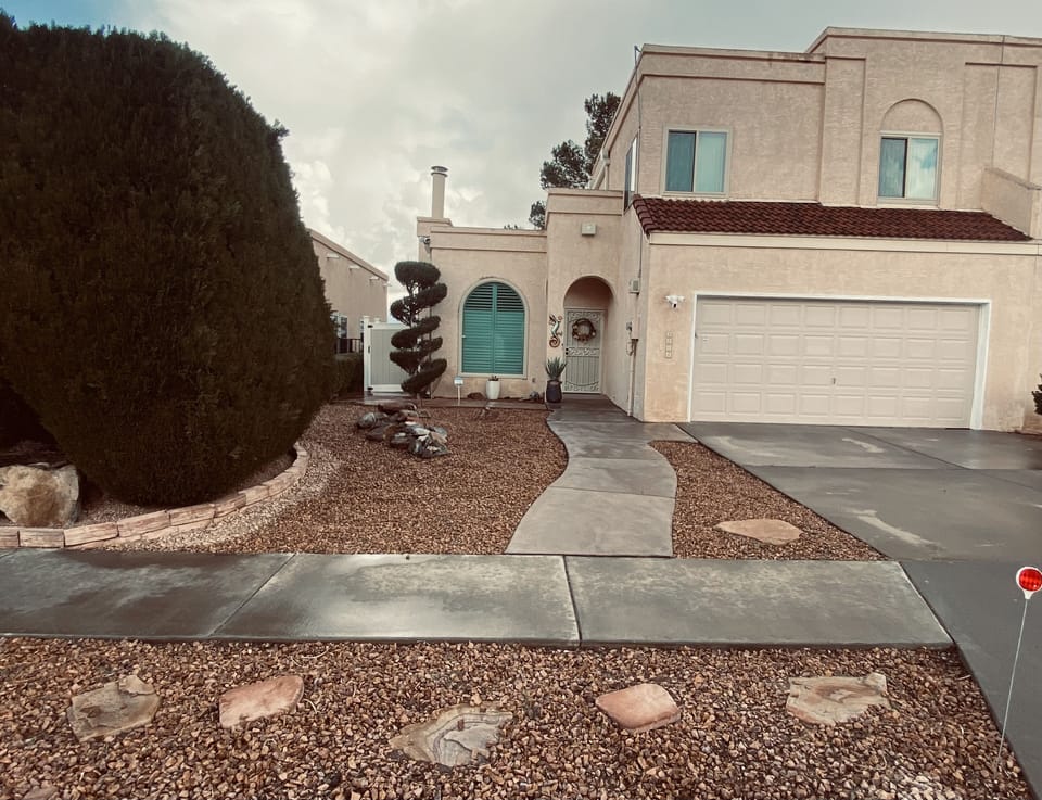 Street view of home, 2-car parking in driveway