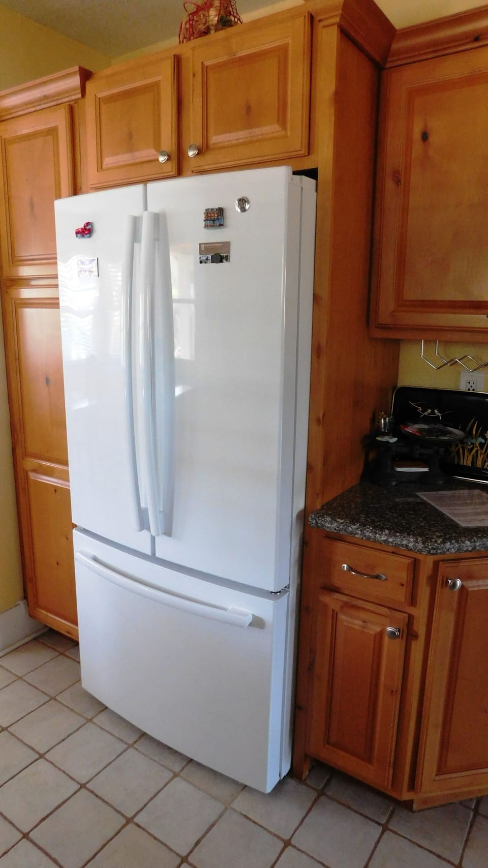 French door bottom freezer with water dispenser.