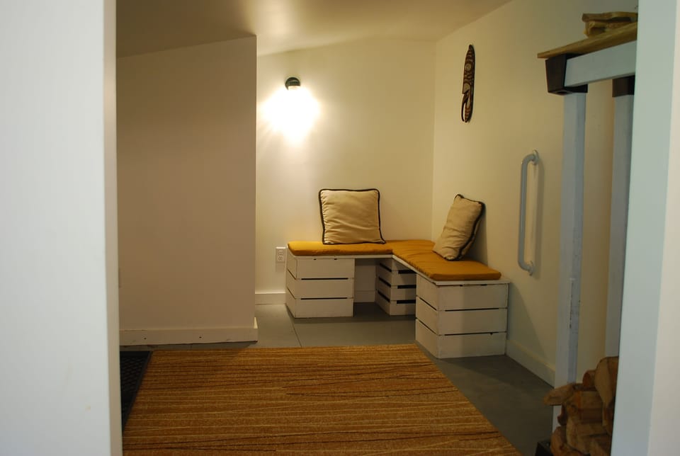 Mud room for flip flops, badminton rackets, and beach towels.