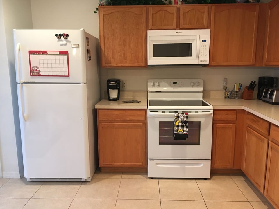 Glass flat top range, microwave, full size refrigerator w/ice maker & dishwasher