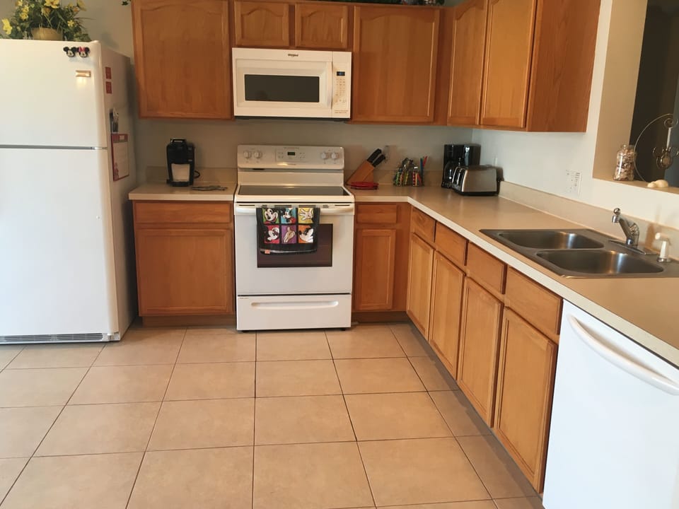 Kitchen w/refrigerator, glass top range, microwave & dishwasher