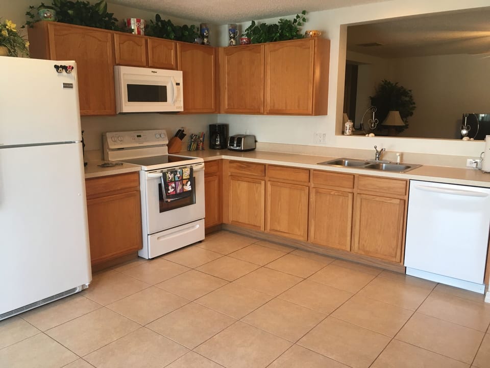 Kitchen w/refrigerator, glass top range, microwave & dishwasher