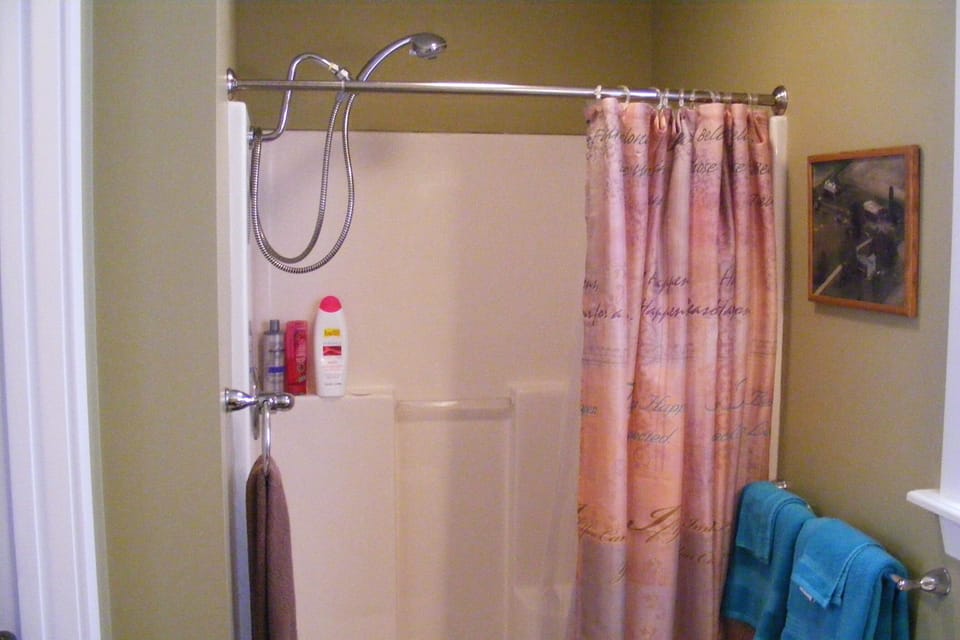 Large sitdown shower with adjustable shower wand.
