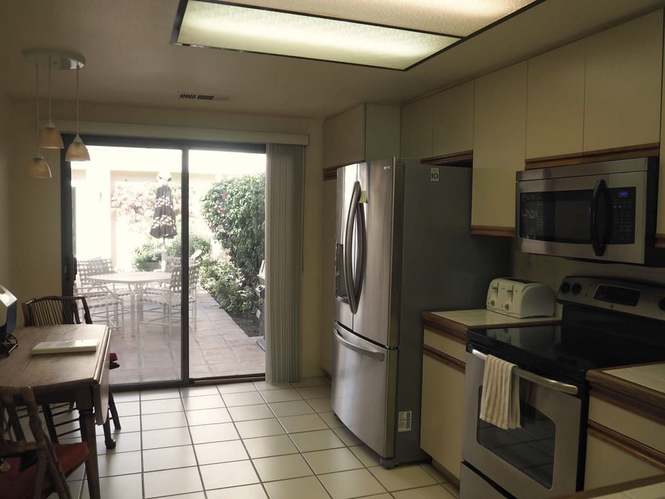 Kitchen with direct access to front patio.