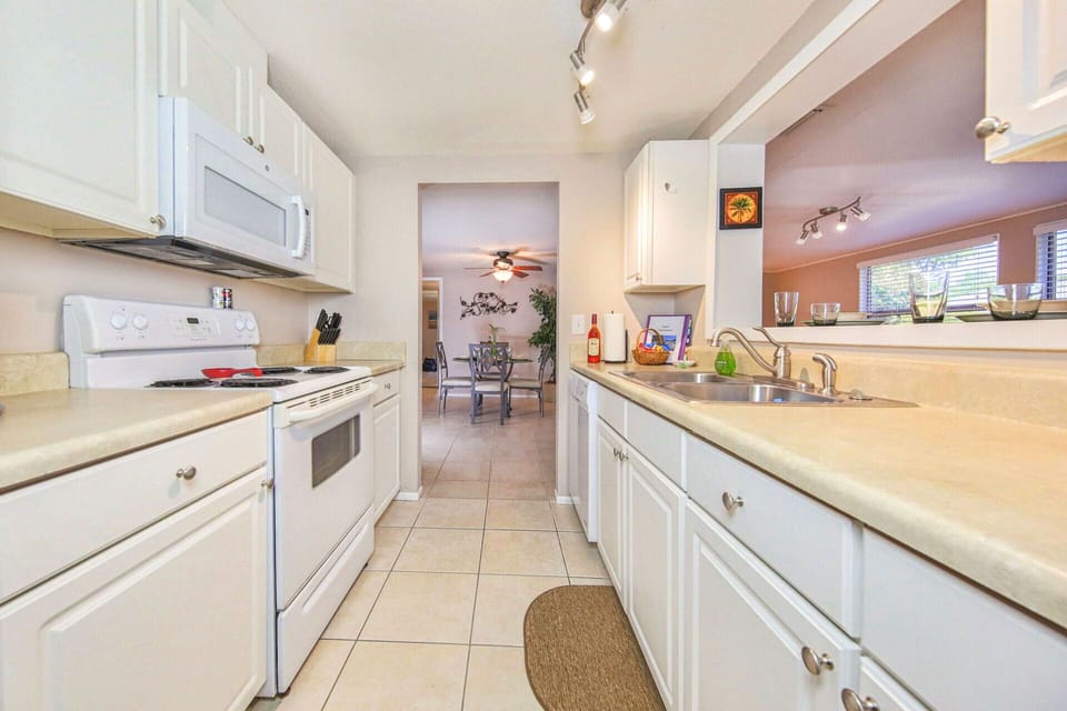 Kitchen has dishwasher, microwave, newer ceramic cooktop oven and more