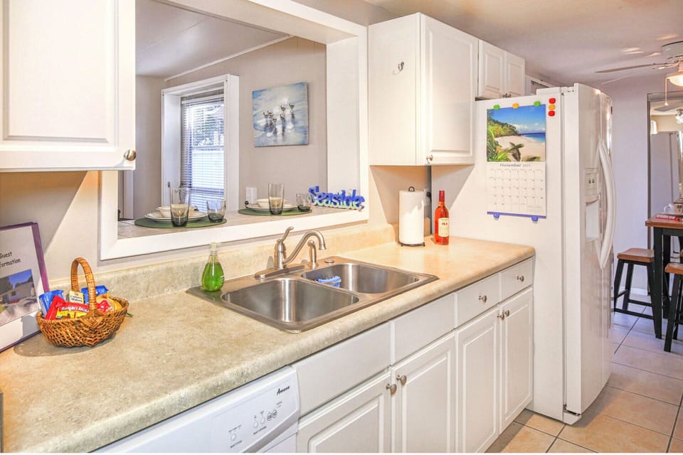 Refrigerator is double door with ice and water dispenser