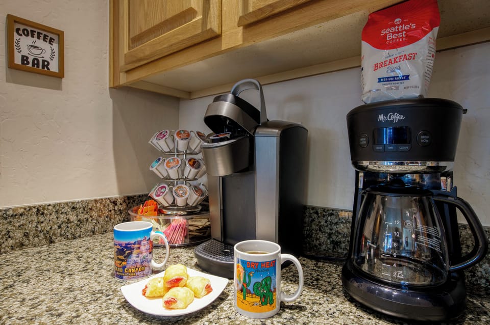 Coffee bar: Keurig, coffee pot, tea pot, coffee k-cups, tea, & breakfast treats.