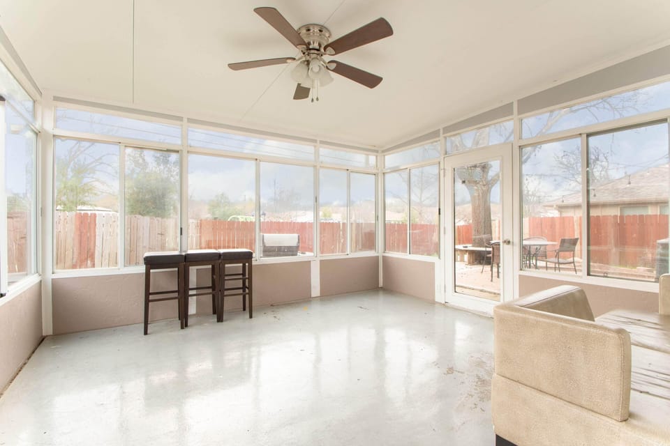 3 season sunroom with all windows and access to deck & public park behind house